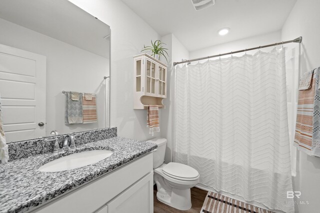 14705 Forsythia Loop, Silverhill, AL 36576 - bathroom featuring vanity, wood finished floors, and shower / bath combination with curtain