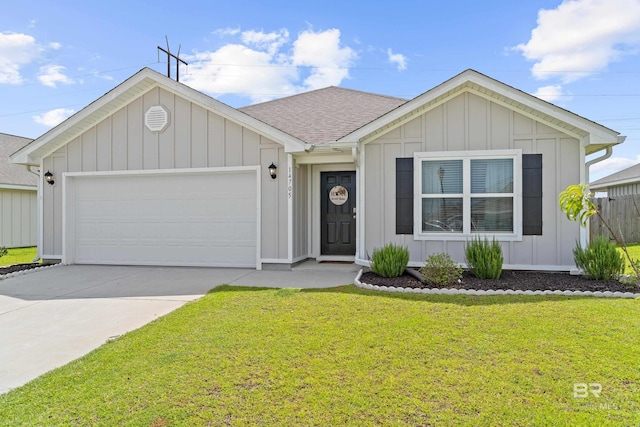 14705 Forsythia Loop, Silverhill, AL 36576 - ranch-style home featuring board and batten siding, an attached garage, concrete driveway, a front lawn, and a shingled roof