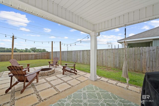 14705 Forsythia Loop, Silverhill, AL 36576 - fenced backyard featuring a fire pit, a patio, and area for grilling