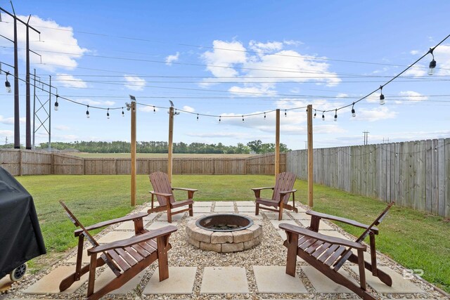 14705 Forsythia Loop, Silverhill, AL 36576 - fenced backyard featuring a fire pit and area for grilling