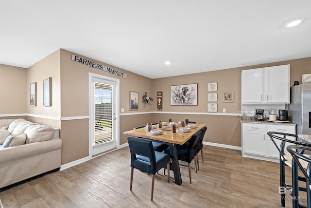 14705 Forsythia Loop, Silverhill, AL 36576 - dining area with light wood finished floors and recessed lighting