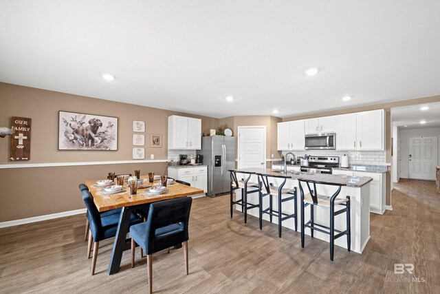14705 Forsythia Loop, Silverhill, AL 36576 - dining space featuring recessed lighting and light wood-style floors