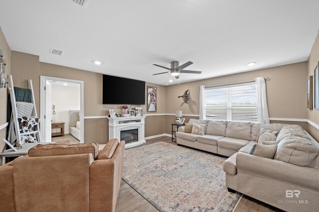 14705 Forsythia Loop, Silverhill, AL 36576 - living room with a ceiling fan, light wood-type flooring, recessed lighting, and a glass covered fireplace