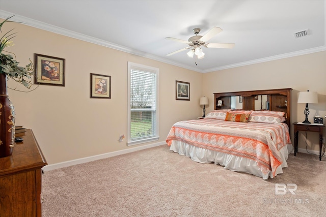 carpeted bedroom with visible vents, baseboards, and crown molding