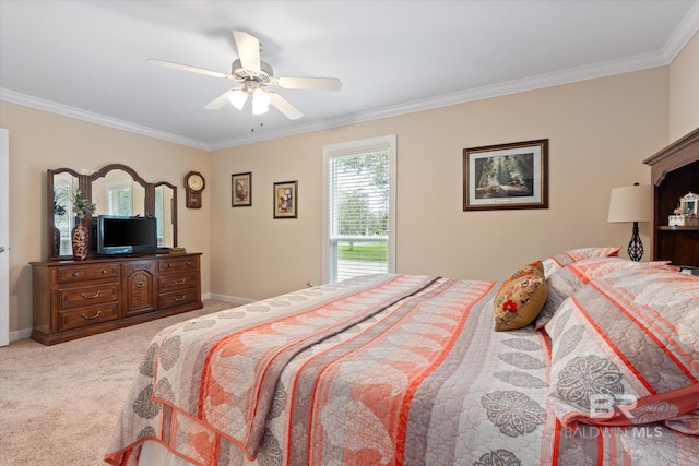 carpeted bedroom featuring ceiling fan, baseboards, and ornamental molding