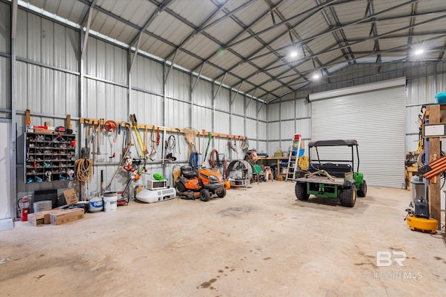 garage featuring metal wall and a workshop area