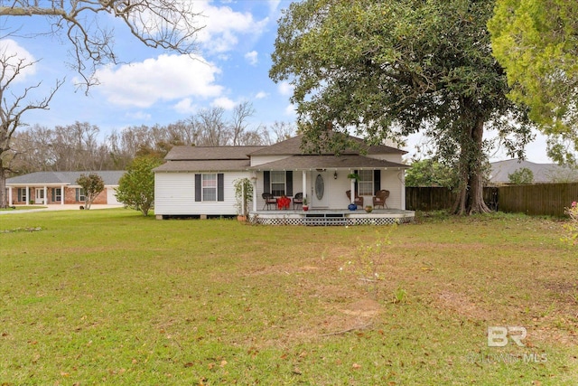 view of front of property featuring a porch, a front lawn, and fence