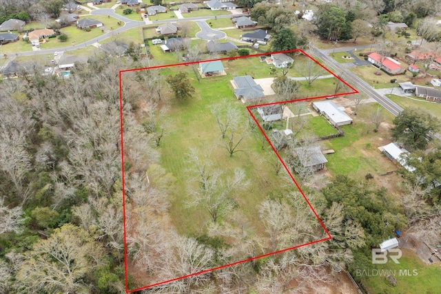 birds eye view of property with a residential view