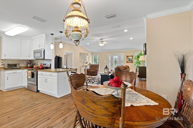 dining area featuring visible vents and crown molding