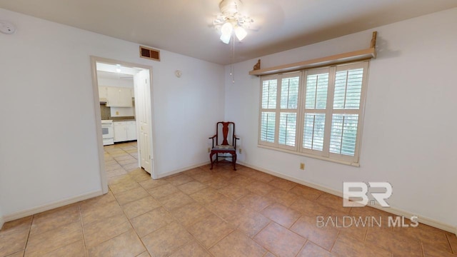 4009 Old Shell Rd Unit C13, Mobile, AL 36608 - empty room featuring baseboards and light tile patterned floors