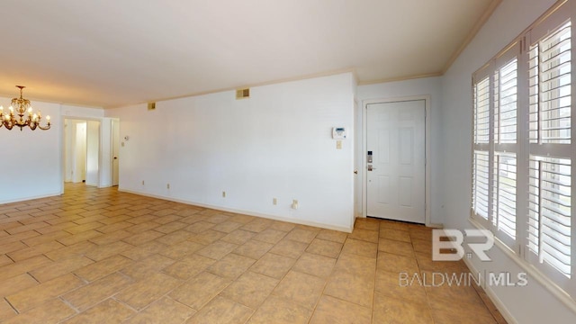 4009 Old Shell Rd Unit C13, Mobile, AL 36608 - spare room with a chandelier, plenty of natural light, crown molding, and baseboards