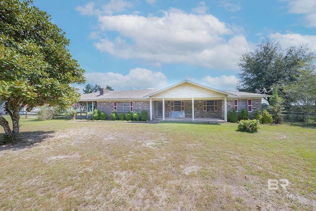 rear view of house with a lawn