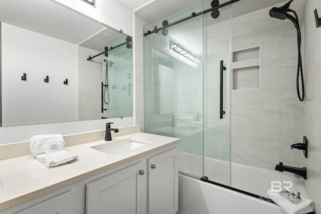 full bath with bath / shower combo with glass door and vanity