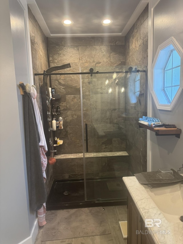 32098 Jessup Ln, Lillian, AL 36549 - bathroom featuring a stall shower, vanity, and recessed lighting