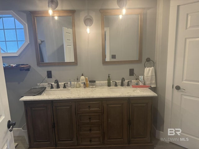 32098 Jessup Ln, Lillian, AL 36549 - full bathroom featuring double vanity and baseboards