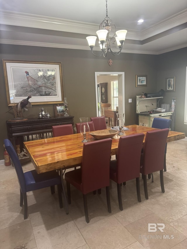 32098 Jessup Ln, Lillian, AL 36549 - dining room featuring a chandelier, a tray ceiling, and ornamental molding