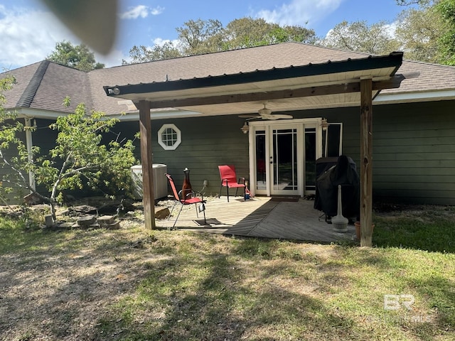 32098 Jessup Ln, Lillian, AL 36549 - rear view of house featuring a wooden deck, ceiling fan, central air condition unit, a lawn, and a shingled roof