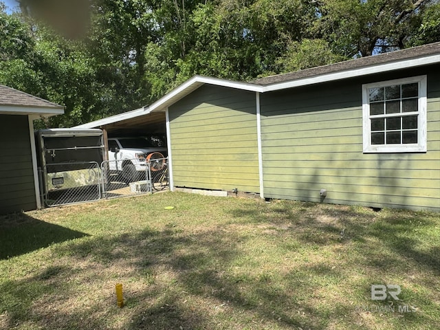 32098 Jessup Ln, Lillian, AL 36549 - view of home's exterior with a yard and a carport