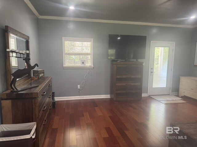 32098 Jessup Ln, Lillian, AL 36549 - foyer entrance featuring dark wood-style floors, ornamental molding, and baseboards