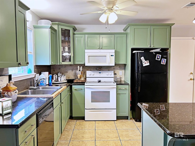 kitchen with black appliances, green cabinetry, a sink, decorative backsplash, and ceiling fan
