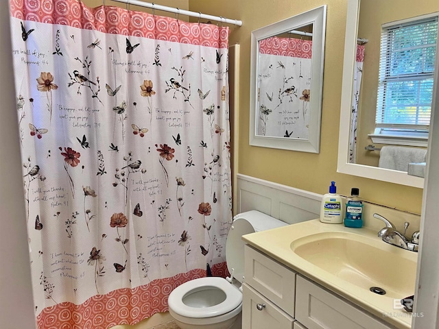 full bathroom with vanity, toilet, and shower / bath combo with shower curtain