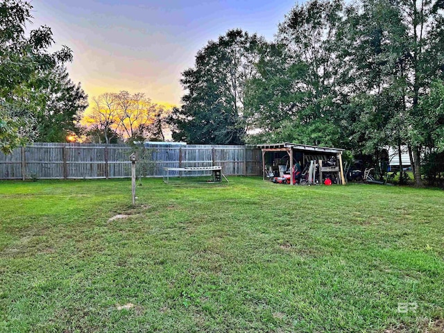 view of yard at dusk