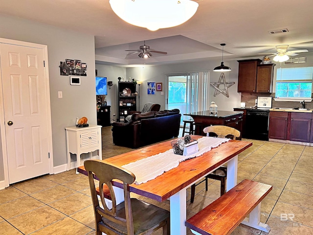 dining area featuring ceiling fan, plenty of natural light, and light tile patterned floors