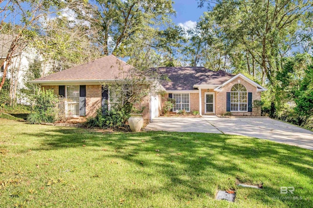 ranch-style home featuring a garage, concrete driveway, brick siding, and a front lawn