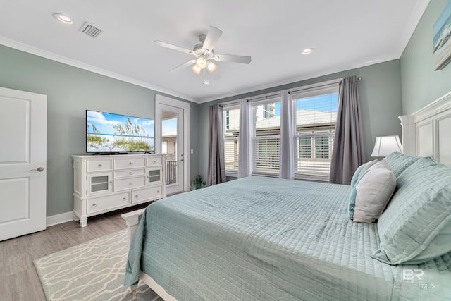 bedroom featuring light wood-style flooring, visible vents, access to exterior, baseboards, and crown molding