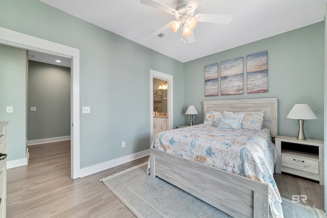 bedroom featuring a ceiling fan, visible vents, light wood-style flooring, and baseboards