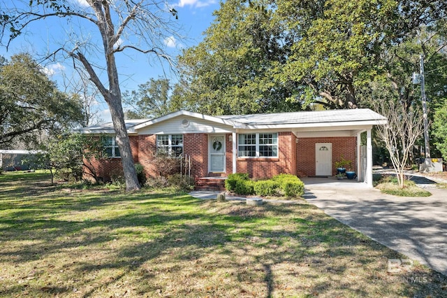 30577 Baldwin St, Perdido Beach, AL 36530 - single story home with brick siding, driveway, a front lawn, and a carport