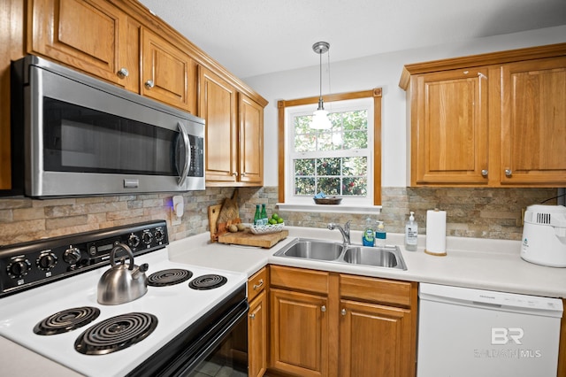 30577 Baldwin St, Perdido Beach, AL 36530 - kitchen with stainless steel microwave, range with electric stovetop, white dishwasher, a sink, and tasteful backsplash