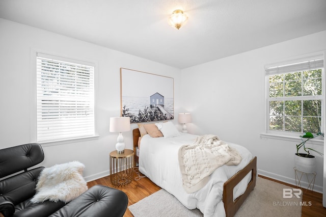 30577 Baldwin St, Perdido Beach, AL 36530 - bedroom featuring baseboards and wood finished floors