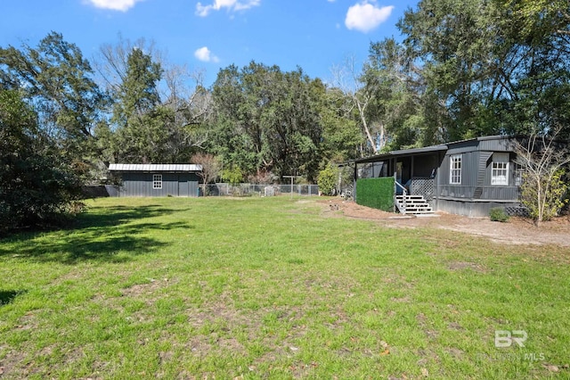 30577 Baldwin St, Perdido Beach, AL 36530 - view of yard with view of wooded area