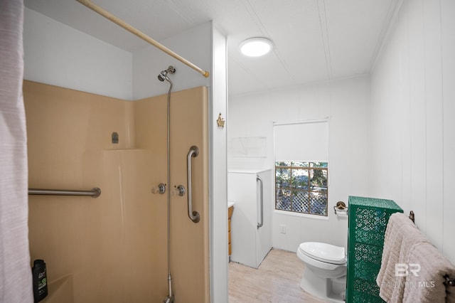 30577 Baldwin St, Perdido Beach, AL 36530 - bathroom with a shower, wood finished floors, and toilet