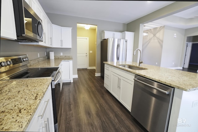 kitchen with white cabinetry, stainless steel appliances, dark wood-type flooring, and a sink