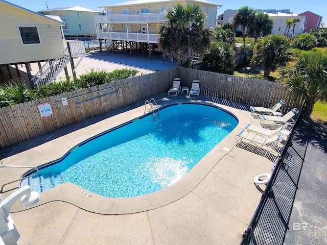 view of swimming pool featuring a patio