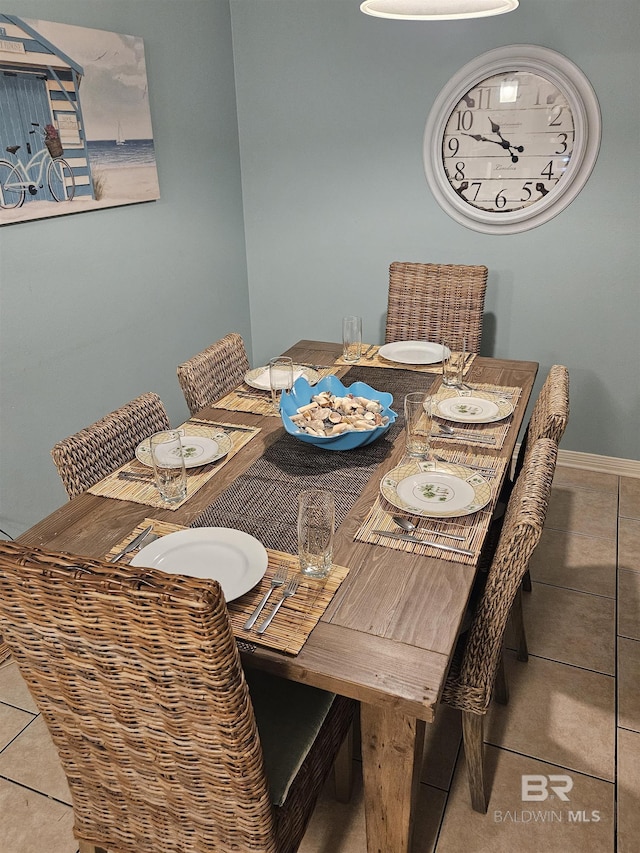 dining room with tile patterned floors