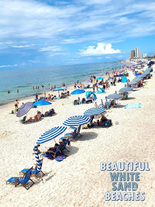 property view of water featuring a beach view