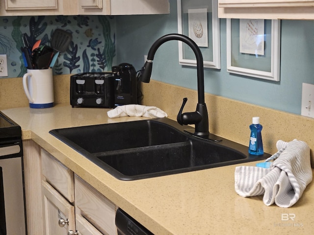 kitchen with sink, stainless steel range with electric stovetop, backsplash, and light brown cabinets