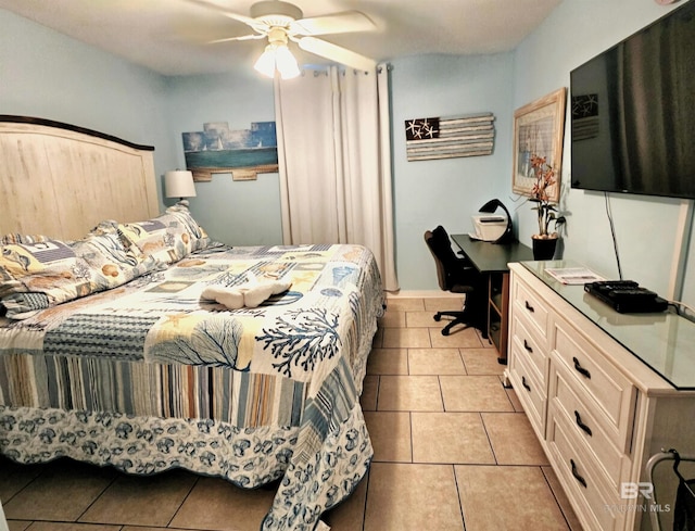 tiled bedroom with ceiling fan