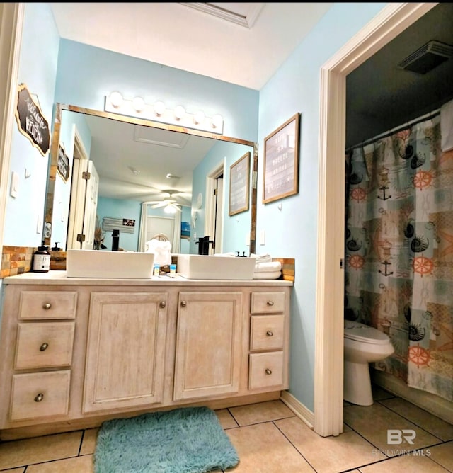 bathroom featuring toilet, tile patterned flooring, a shower with curtain, and vanity