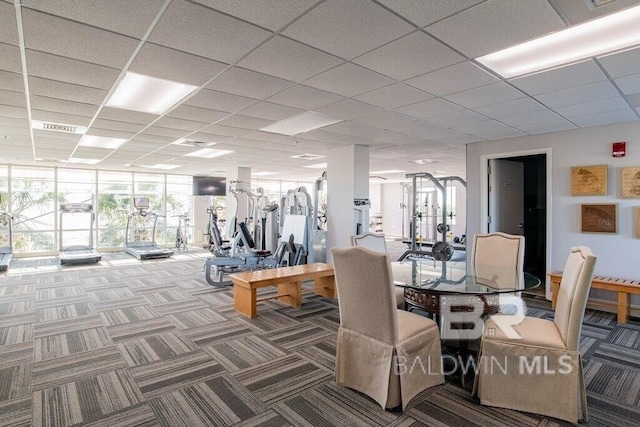 workout area with carpet floors, a paneled ceiling, and visible vents