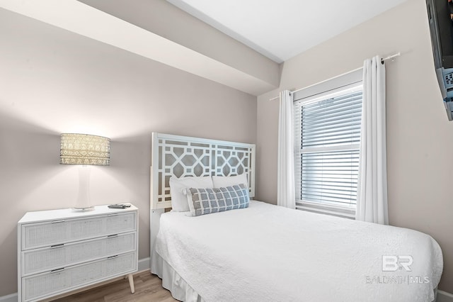 bedroom with wood finished floors