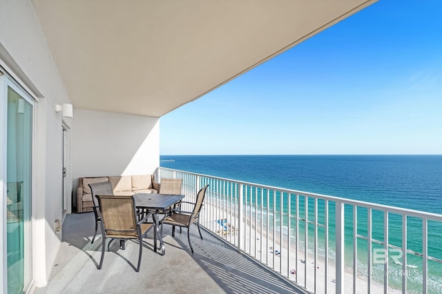 balcony with a view of the beach and a water view