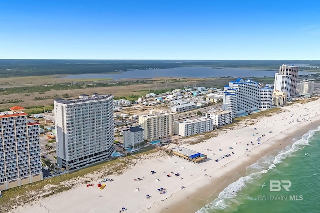 bird's eye view with a water view, a beach view, and a city view