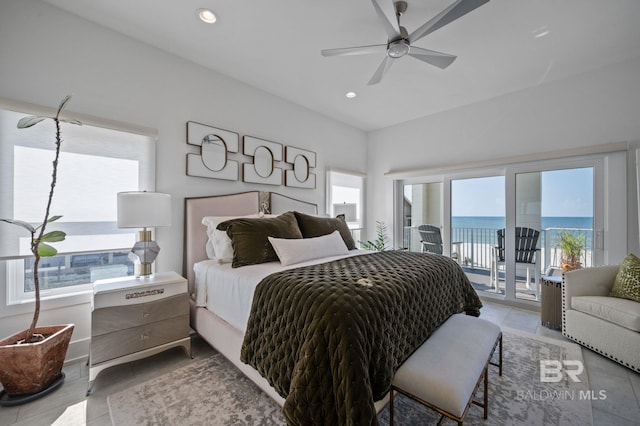 bedroom featuring light tile patterned floors, ceiling fan, recessed lighting, a water view, and access to outside