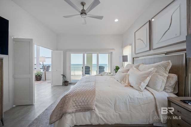 bedroom featuring recessed lighting, a water view, a ceiling fan, and access to exterior