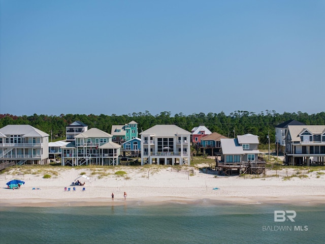 aerial view with a water view and a view of the beach