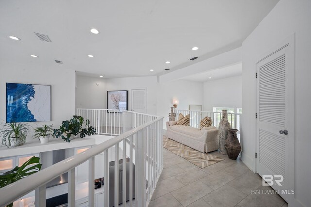 interior space featuring light tile patterned flooring, visible vents, and recessed lighting